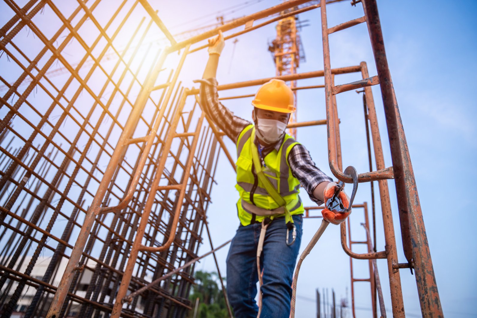 Asian worker working at height equipment constructive at con